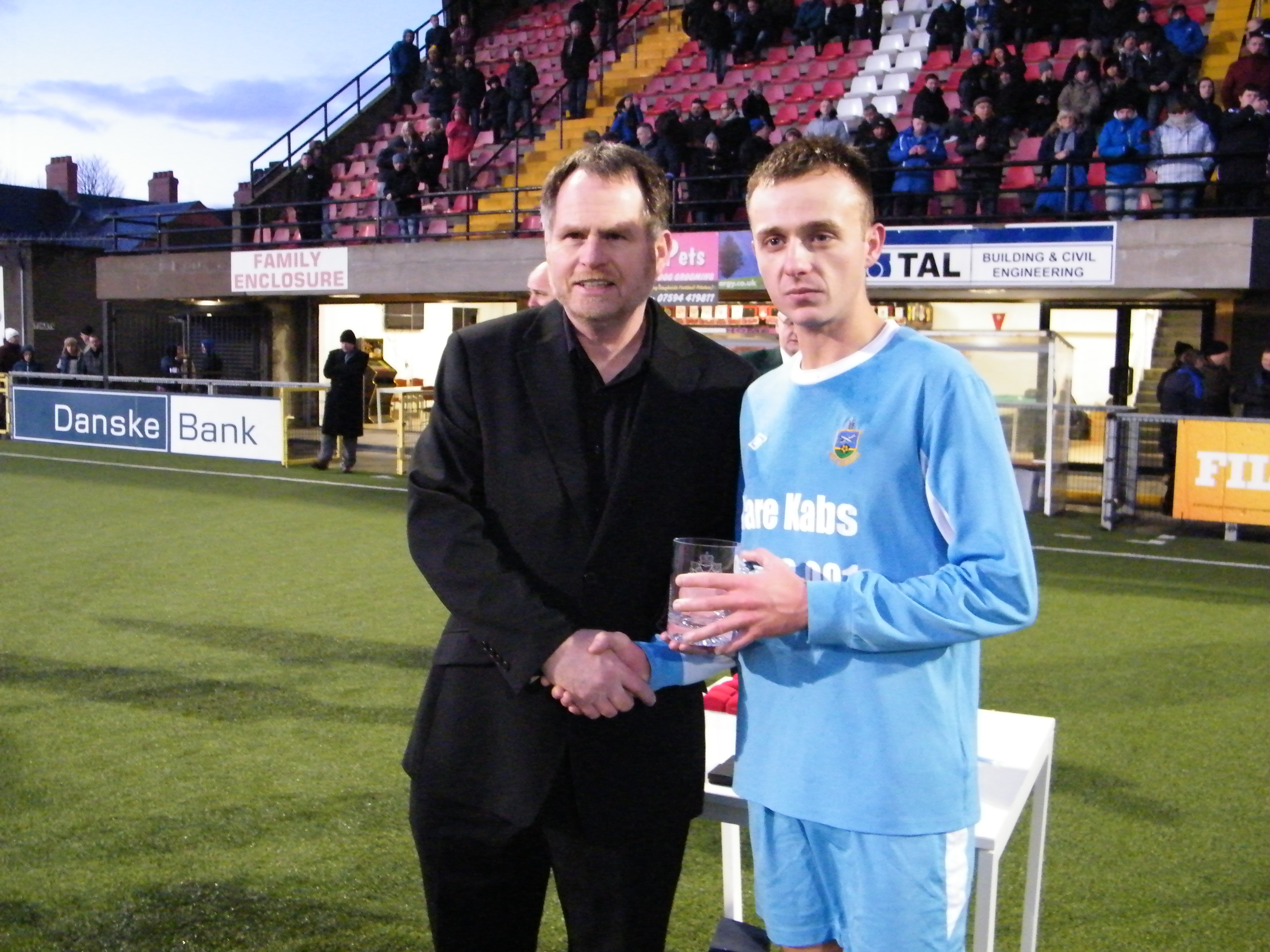 Man of the Match Man of the Match trophy presented to Ryan Newberry of Ards Rgs by Daily Mirror Editor Ronnie Haughey